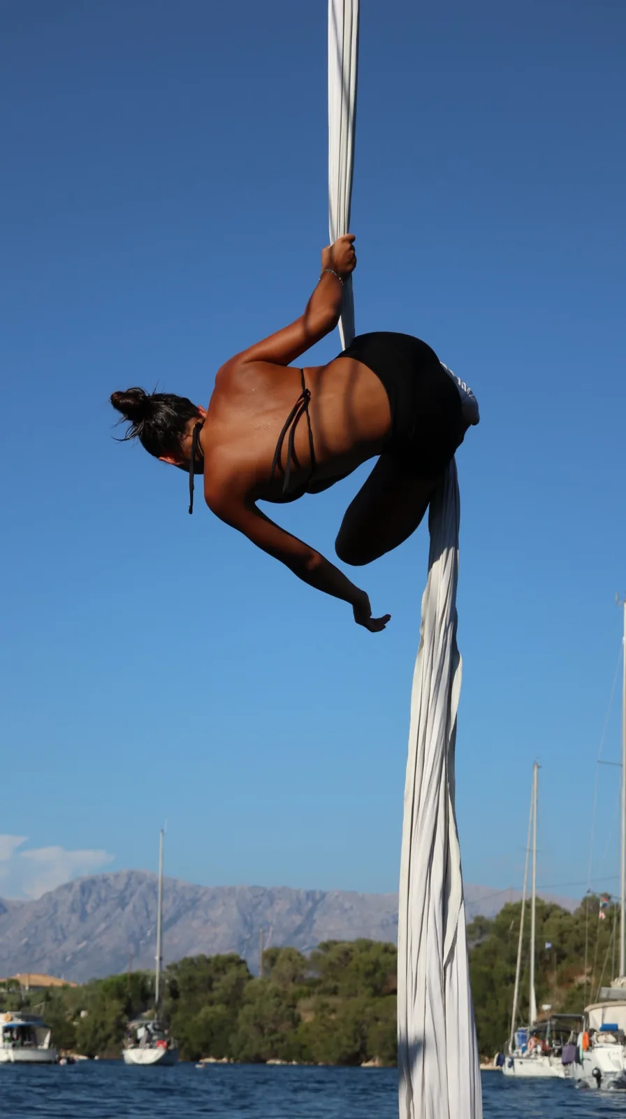 Inverted drop on white silks above the water